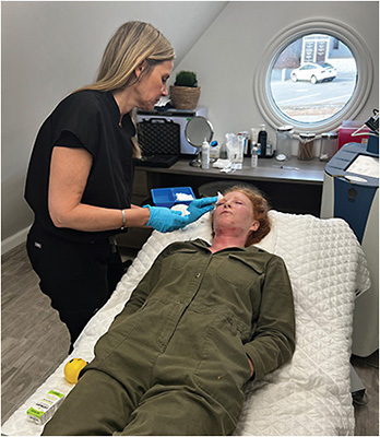 Sarah, an ophthalmic tech, doing post-injection cleanup and applying postoperative skincare after CO2 laser resurfacing.IMAGE COURTESY DR. MELISSA TOYOS