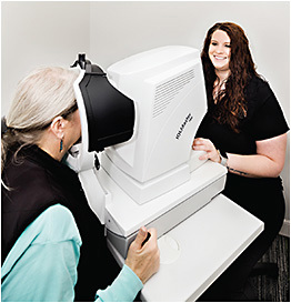 Lauren Poole, technician, prepares the patient for the IOL master testing.